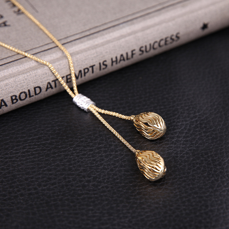 0a9af54e 6f32 4d65 a396 43cd757807e9 Austrian Crystal Cutout Texture Drop Pendant