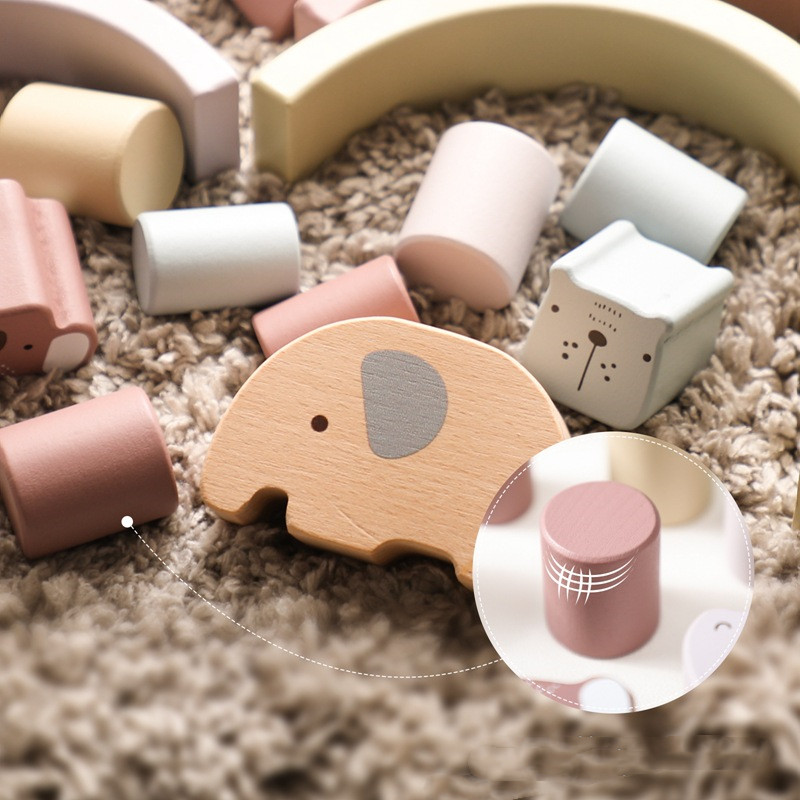 Soulful Trading's Montessori Educational Wooden Toy among pastel-colored blocks on a textured rug, suggesting a playful and educational setting for children.