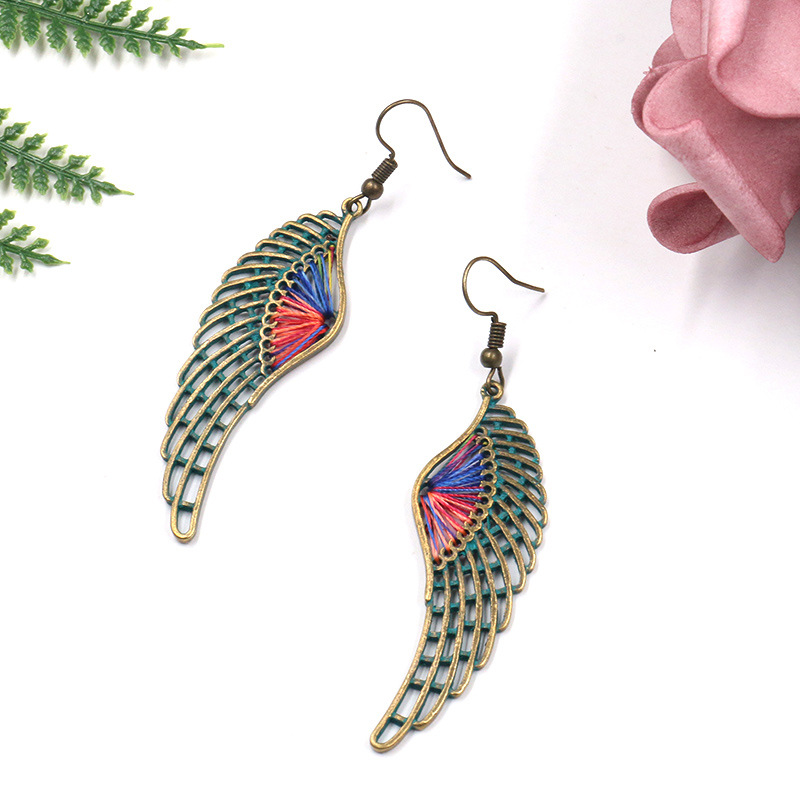 1613636307552 Popular Hollow Alloy Angel Wings Earrings Women