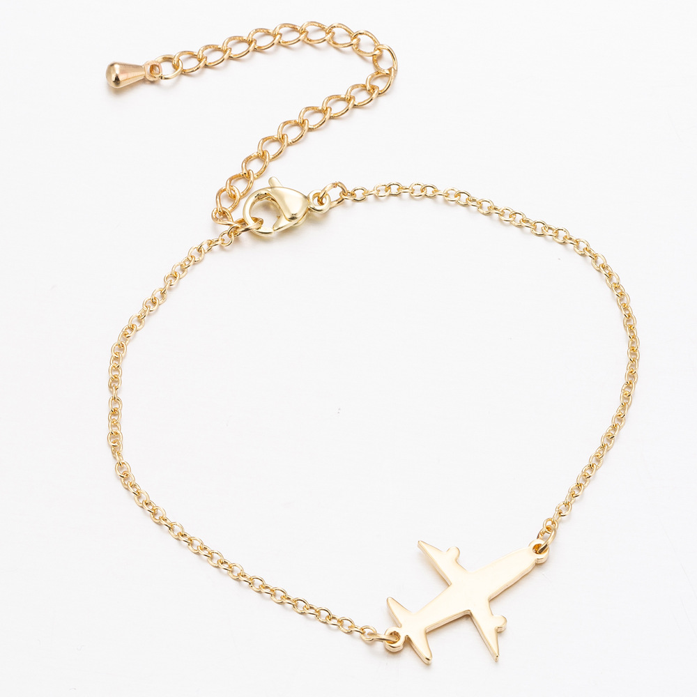 Gold Unique Aircraft Bracelet with aviation-themed charms for aviation enthusiasts Meléche Jewelry USA