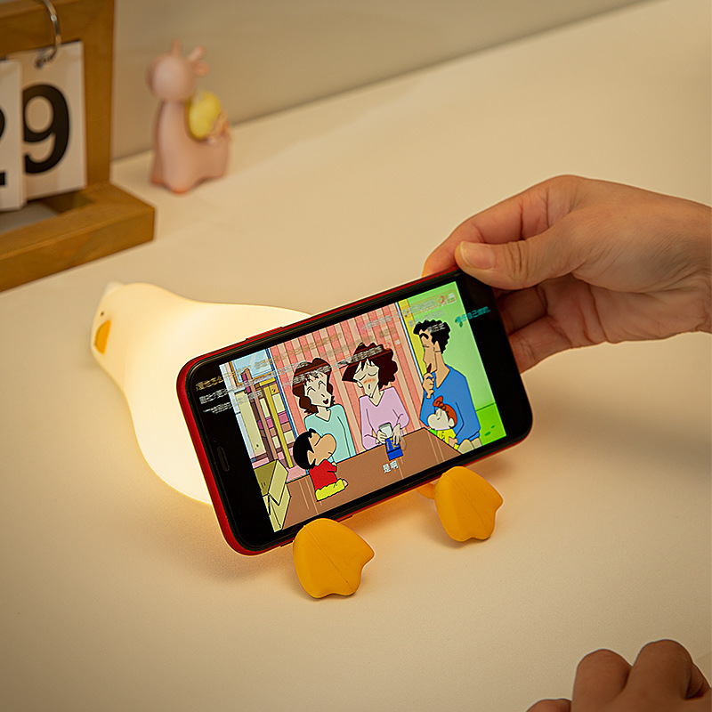 existential crisis duck lamp is a great phone holder
