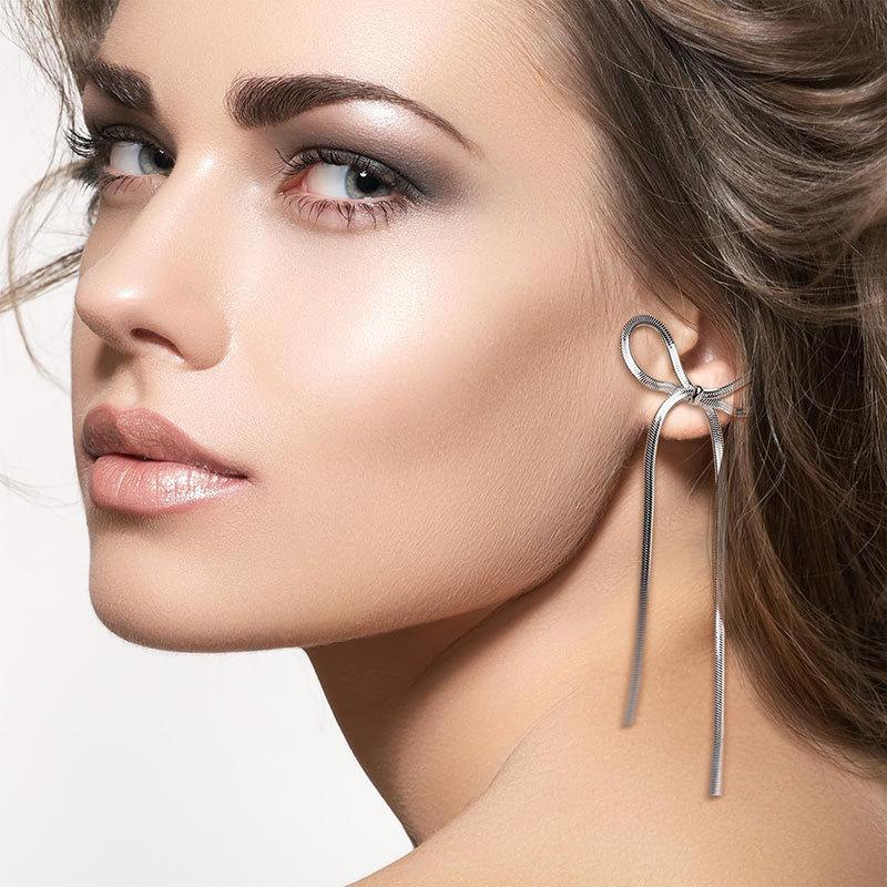 "Elevate your style with Women's Bow Tassel Long Earrings – a perfect blend of elegance and charm." image  3