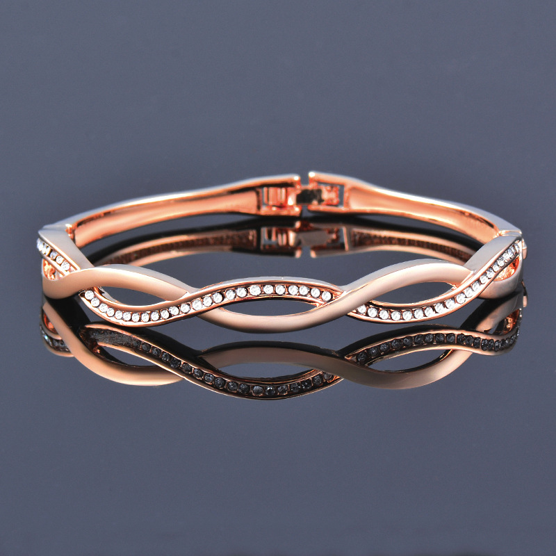 208e639f 1aec 4ea1 8f2a 94c080cf22c0 Japanese And Korean Diamond Wave Cross Hollow Gold Plated Bracelet