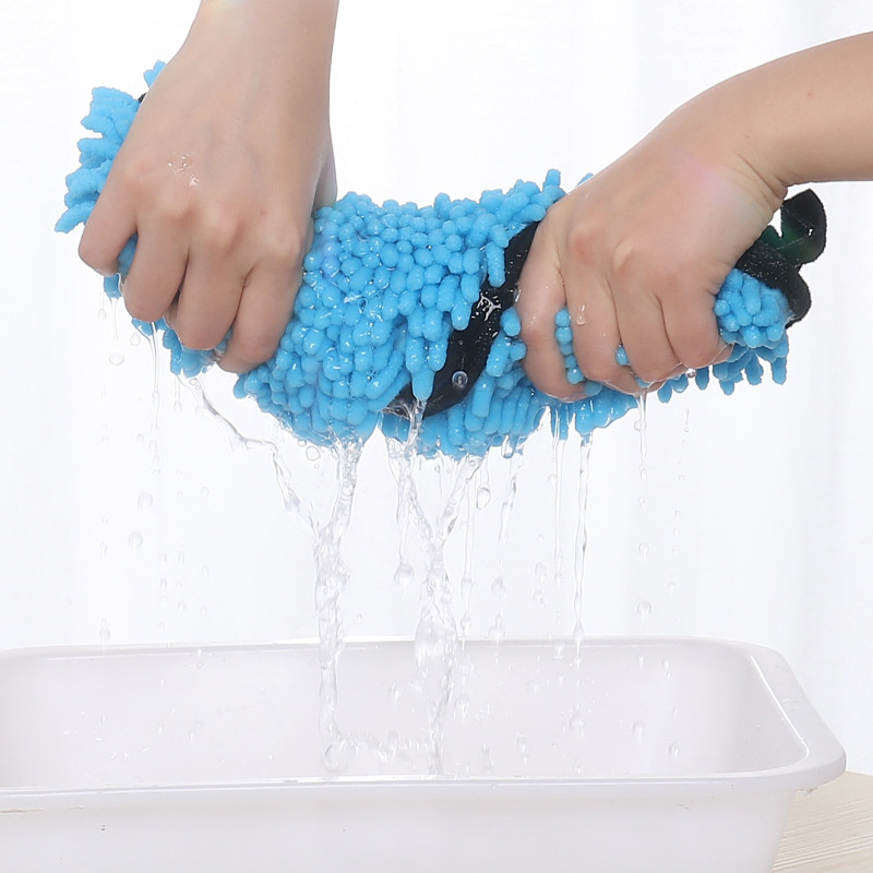 Hands squeezing water from a high-quality pet towel