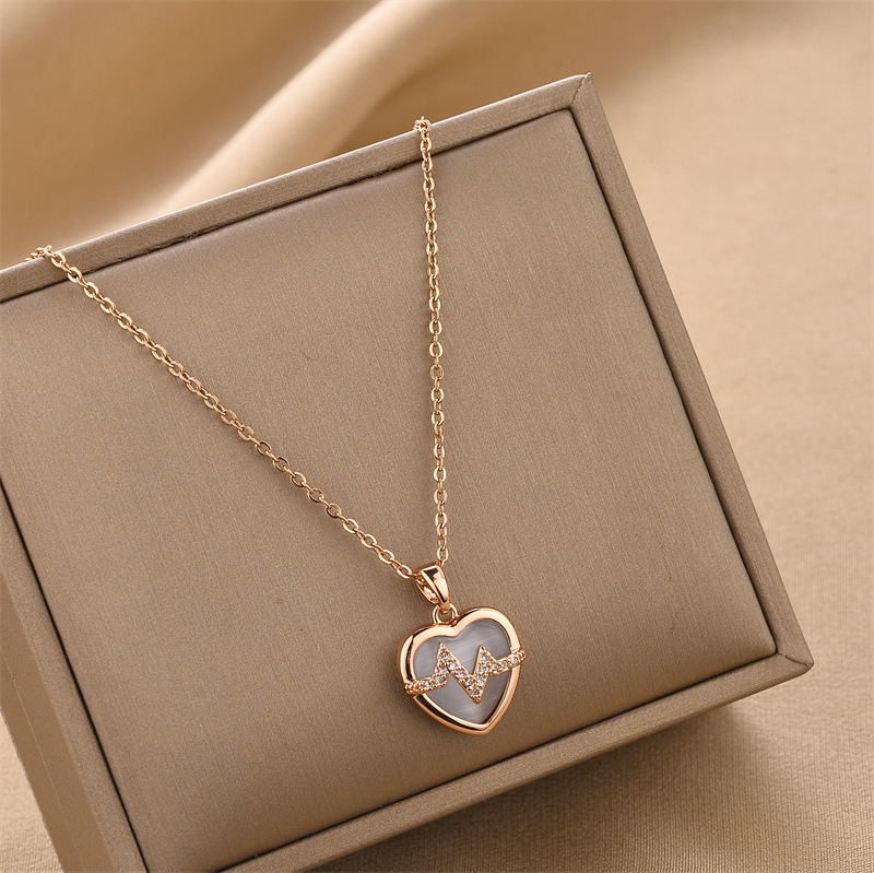 41b8ce89 17d8 4b60 80a5 9341880b4968 18K Gold Plated Stainless Steel Heart Pendant Necklace In Titanium