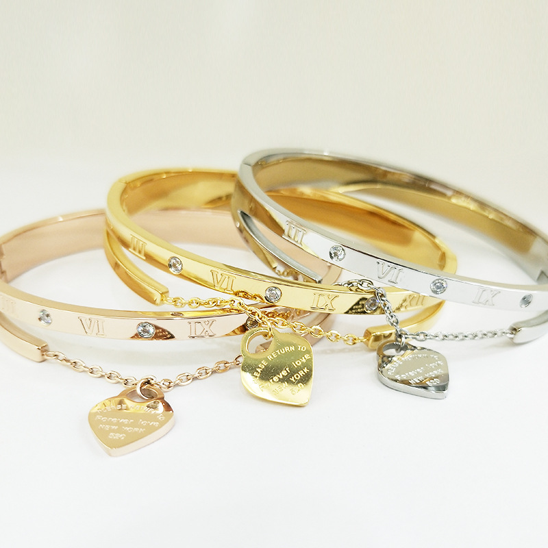 86c97d90 0397 4892 95f7 3e6e6dd714bb Women's Lettering Gold Titanium Steel Bracelet