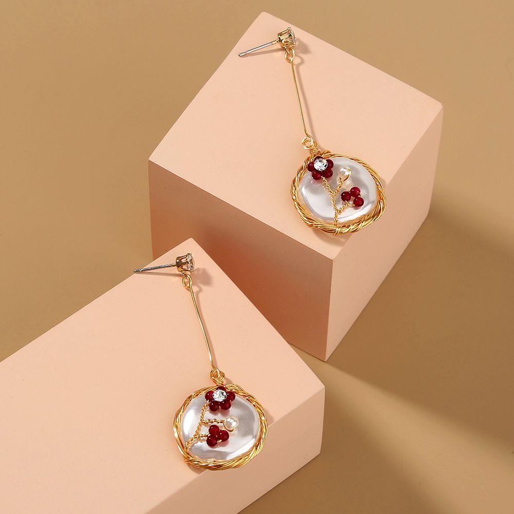 9d72efe6 5327 4280 936c 14615c247a1d Hand-wound natural stone flower long Tassel red white earrings
