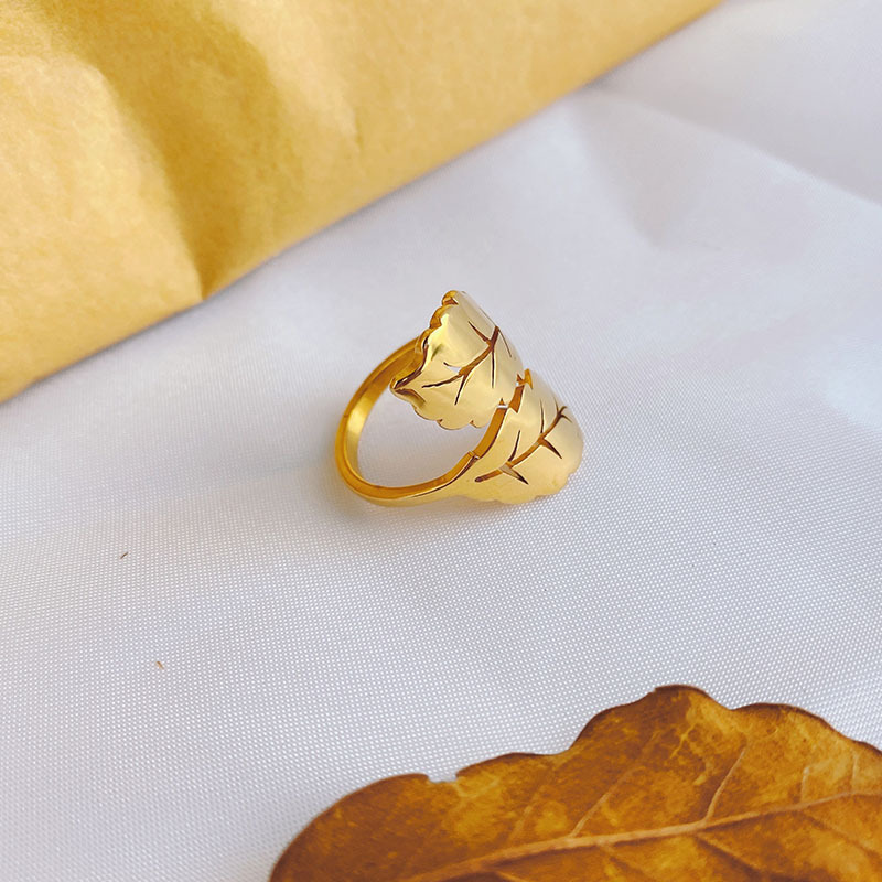 a07a56e0 4009 4d85 b8c5 6e7ae0486632 Simple Titanium Steel Ring Female Leaf 18k Gold Niche High-grade Sense
