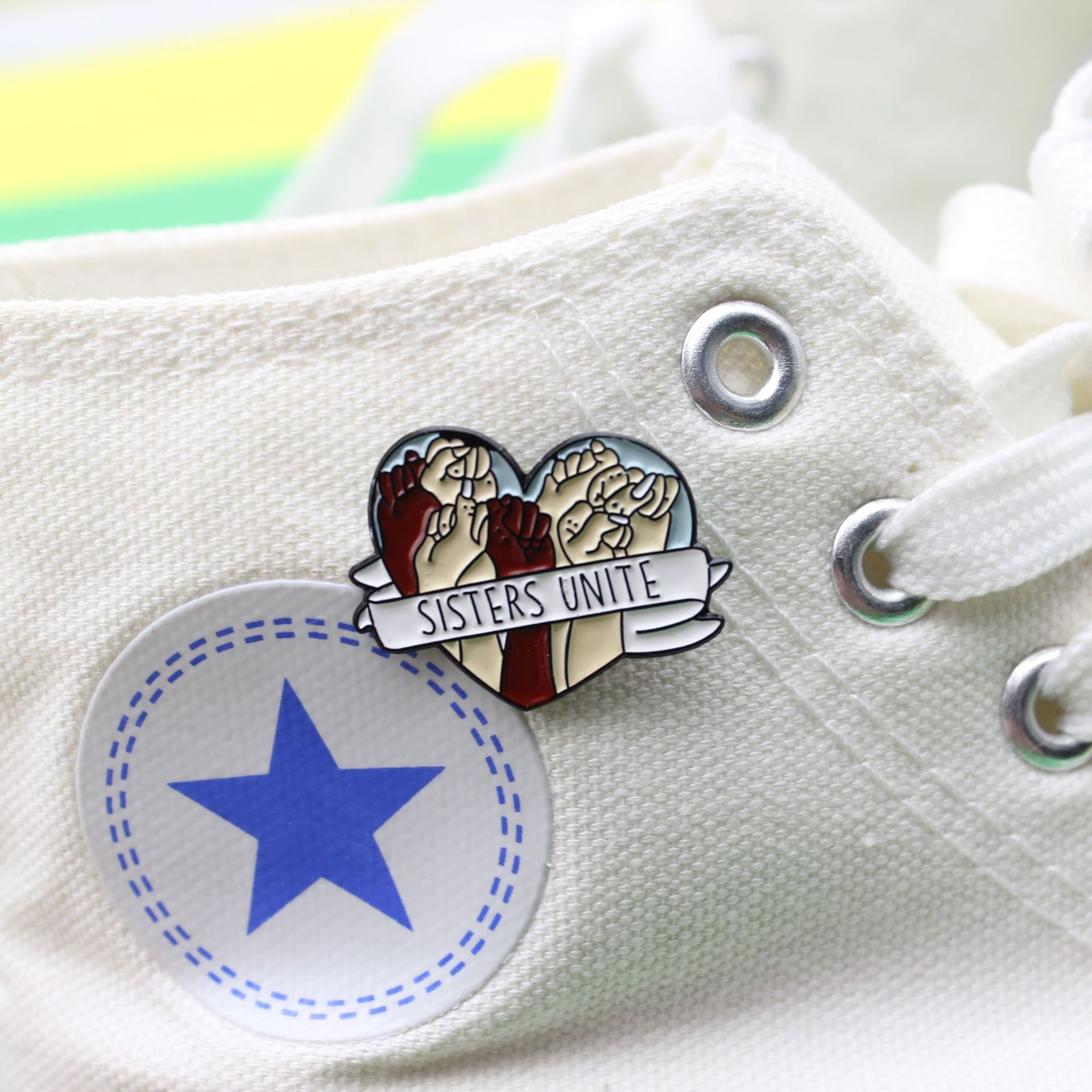 b1581c79 82da 4823 aede 84df5c0fd030 Heart-Shaped Ribbon Wrapped Around a Fist Brooch