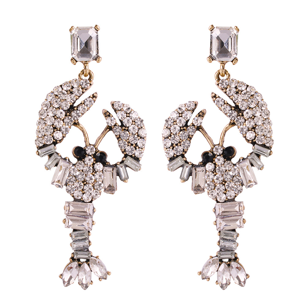 b4aeafa4 7bbc 4430 b386 4f50a529605f Lobster Stud Earrings Color Diamond Earrings