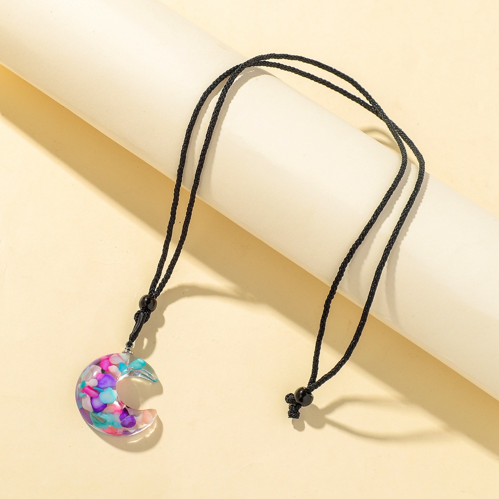 b4d6a5c9 8266 4c06 8367 655bcfe5be6b Transparent Resin Rough Moon Pendant