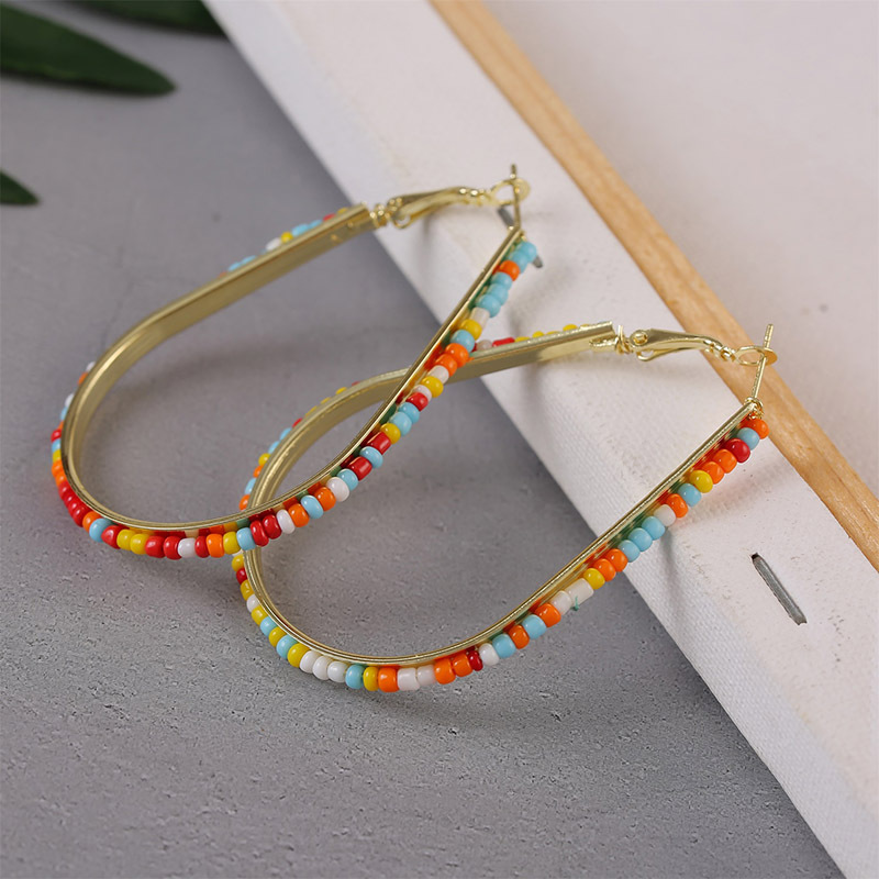 baaf5c86 7e0f 4934 8d4a b8242cdc7ec1 Geometric Handmade Rice Beads Heart Earrings