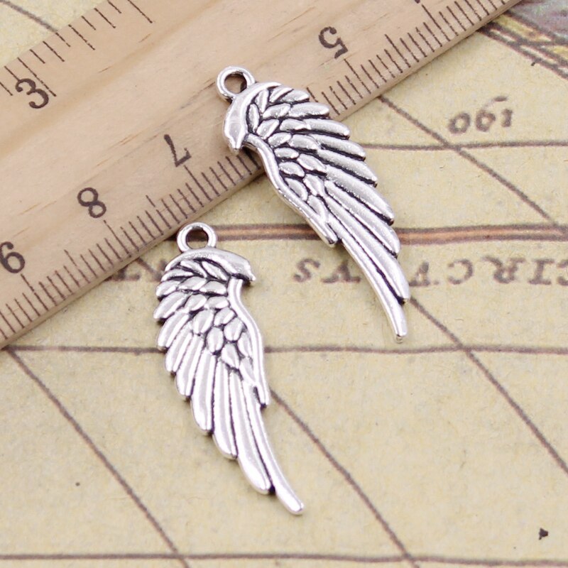 bb6443f8 0545 47c1 a657 b12e70eecaa6 Antique Silver Double-sided Wings Small Pendant Jewelry Accessories