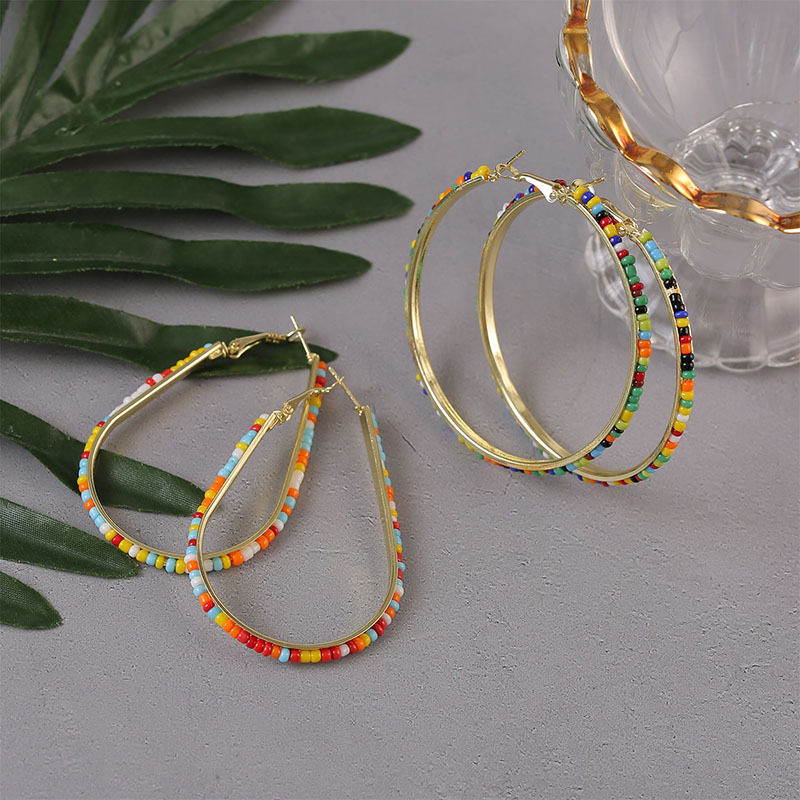 bcfac21e 65d2 47da bcb2 17cbbbb472ea Geometric Handmade Rice Beads Heart Earrings