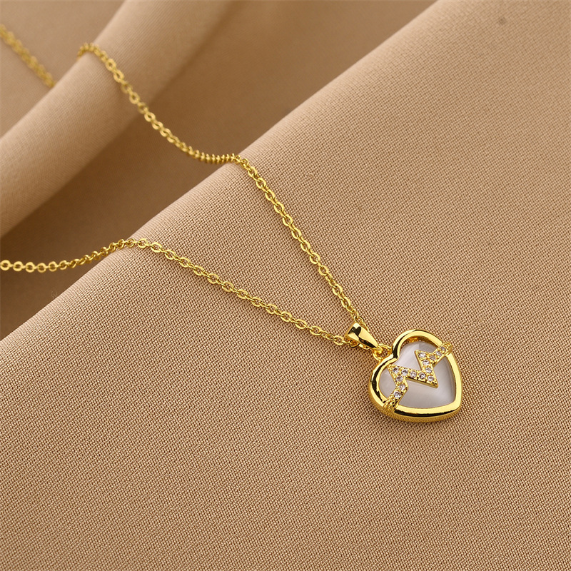 c3dbba5d 87ae 4979 aa7d aec9a1925b61 18K Gold Plated Stainless Steel Heart Pendant Necklace In Titanium