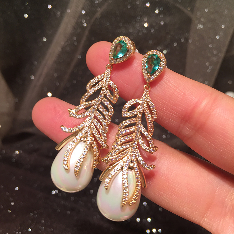 c6bf7fac b36c 4133 a9c1 0e7f2a5d71cc Gradient Color Leaves Atmospheric Net Red Earrings