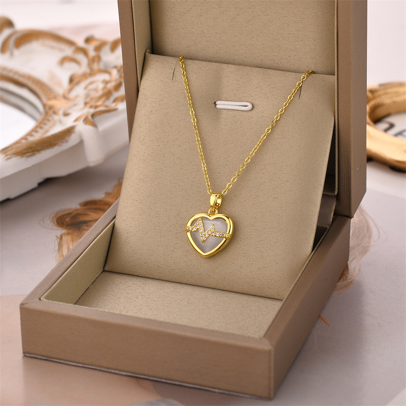 d0d8d4f3 d909 41c8 abaa 2ccaed445c5e 18K Gold Plated Stainless Steel Heart Pendant Necklace In Titanium