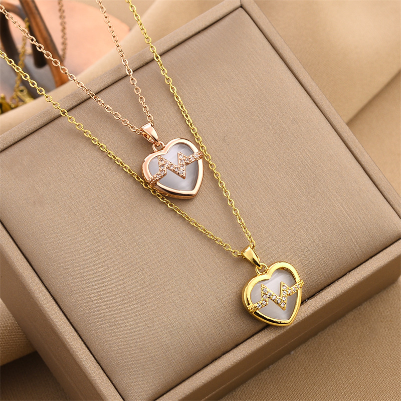 dc67ba70 5a46 41b1 bdb9 641a8a49ae63 18K Gold Plated Stainless Steel Heart Pendant Necklace In Titanium