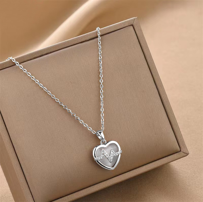 fd1160c2 f381 49b4 8ed7 8b9d57261835 18K Gold Plated Stainless Steel Heart Pendant Necklace In Titanium