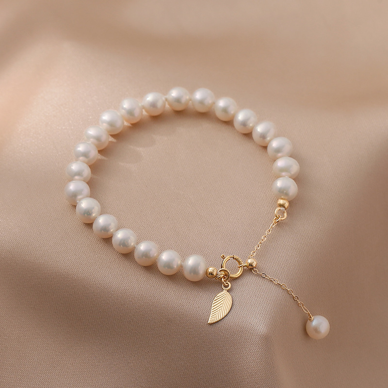 ff9ea4ec ac43 4ca9 9dae 27372df325e0 Natural Freshwater Pearl 14K Gold Niche Design Elegant Bracelet